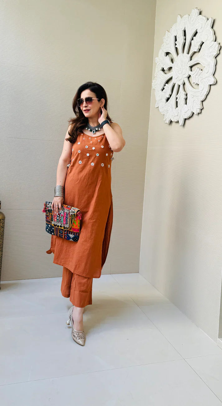Rust Sleeveless Kurta Set with White Tassel Embellishments
